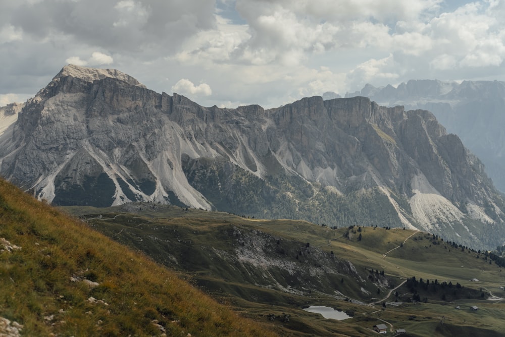 a view of a mountain range with clouds in the sky