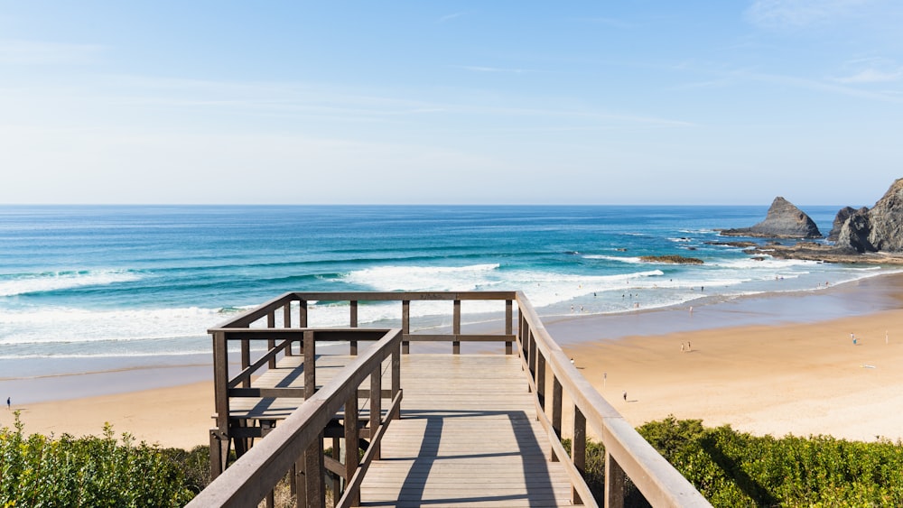 a wooden walkway leading to the beach