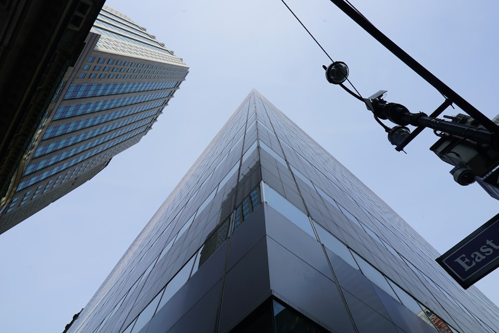looking up at a tall building from a street corner