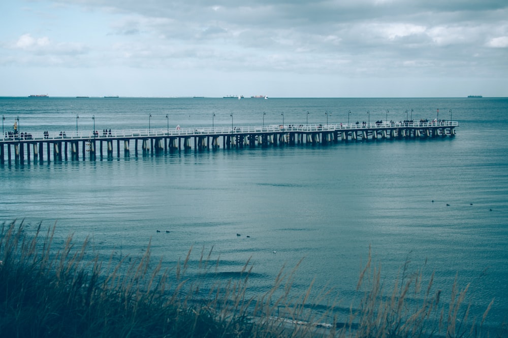 a pier in the middle of a body of water