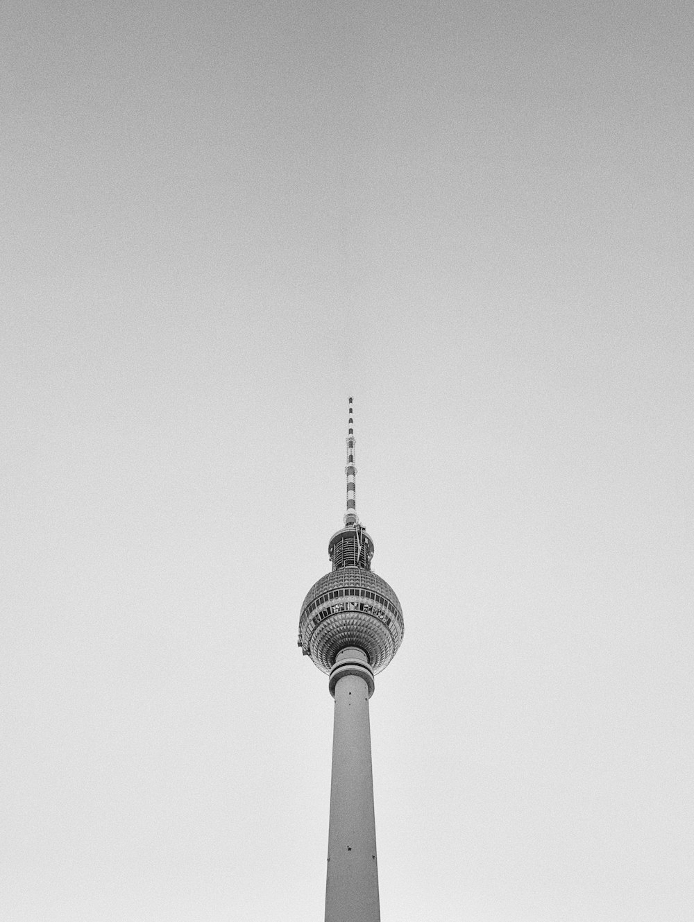 a black and white photo of a tall tower