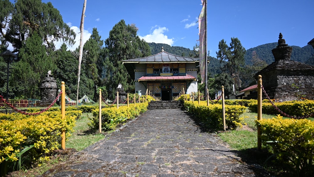 a path leading to a building in a park