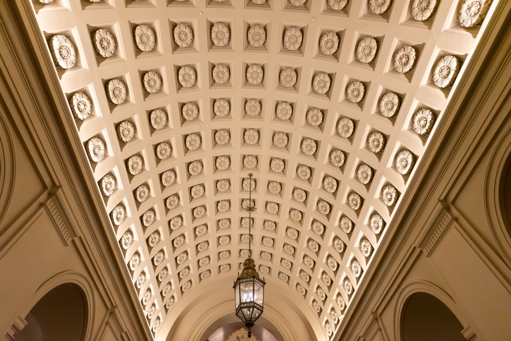 the ceiling of a church with a clock on it