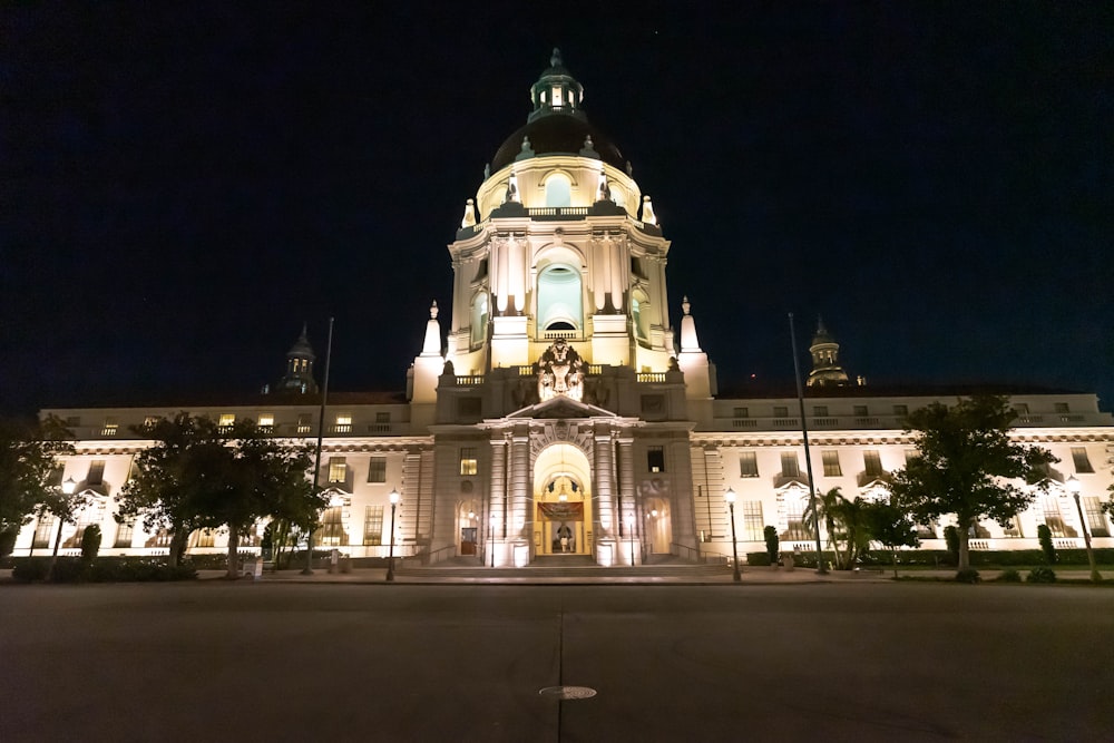 a large building with a clock tower at night