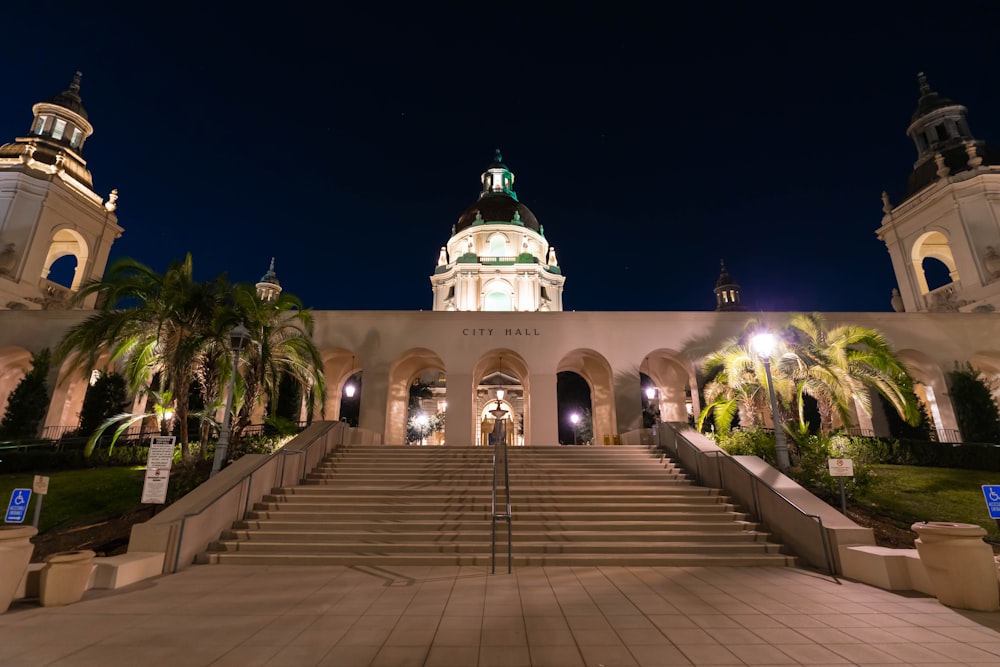 a large building with a clock tower at night