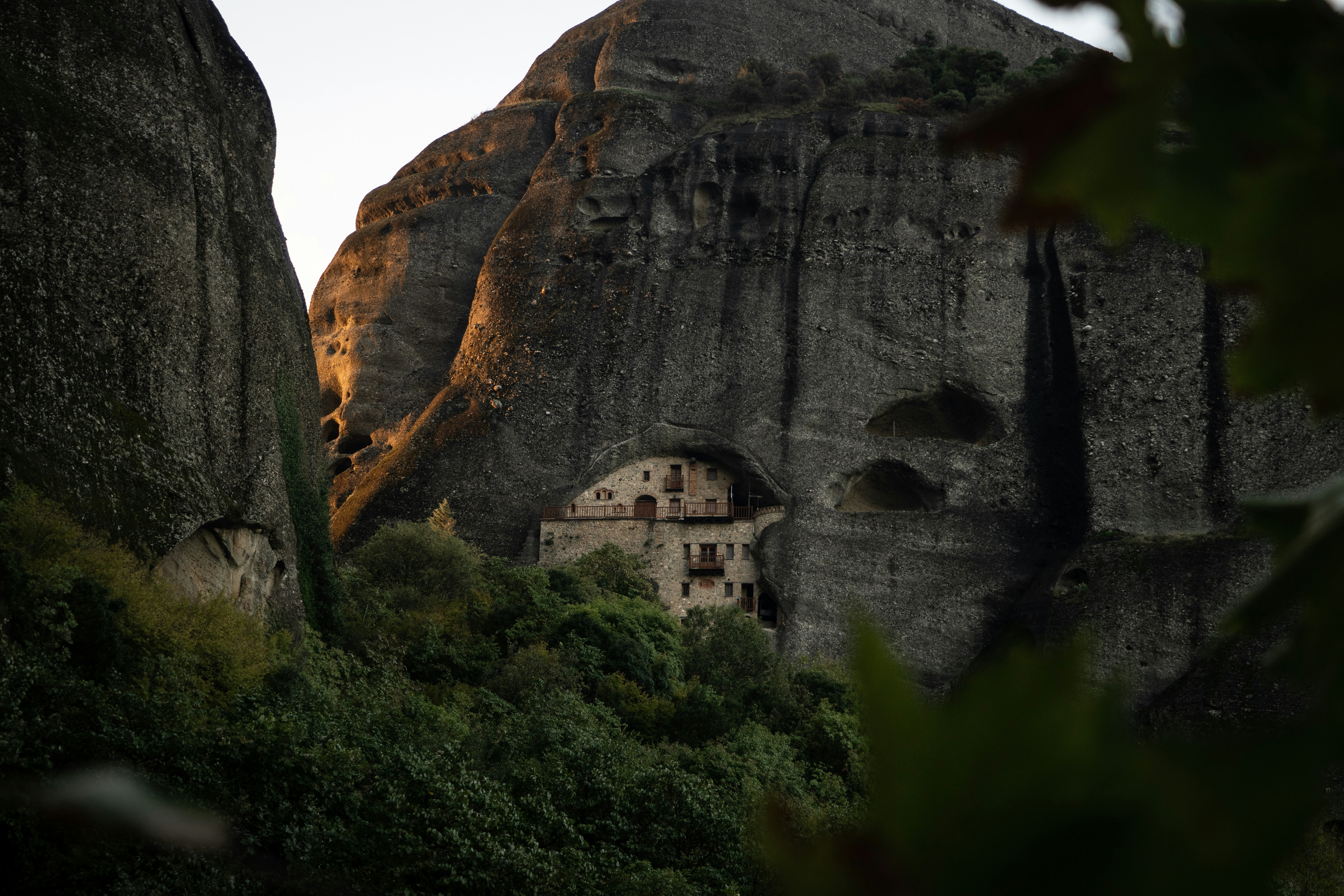a giraffe standing on top of a mountain