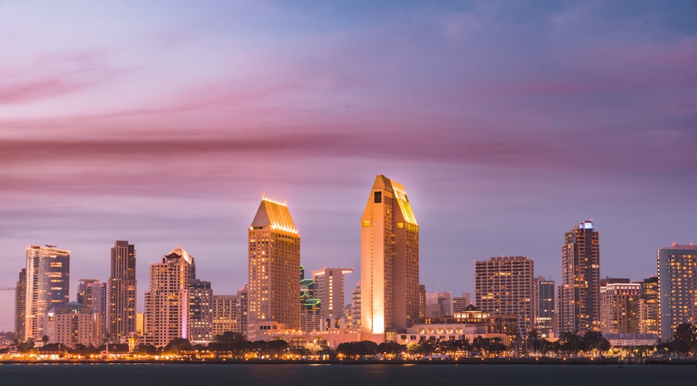 a large body of water with a city in the background