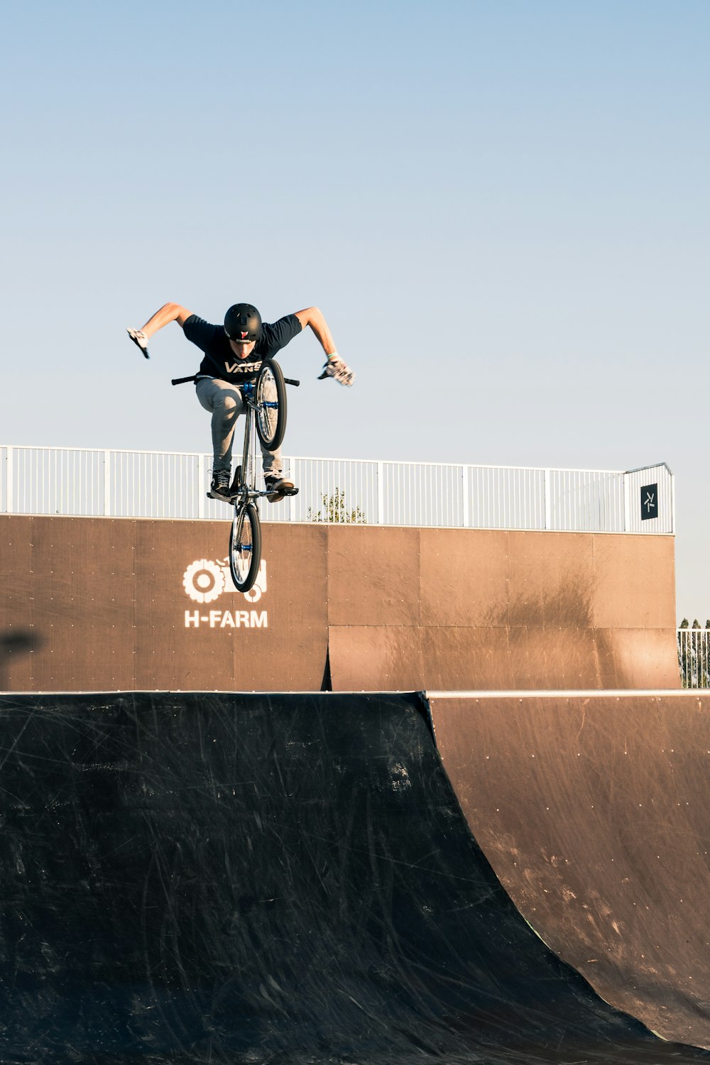 a man riding a skateboard up the side of a ramp