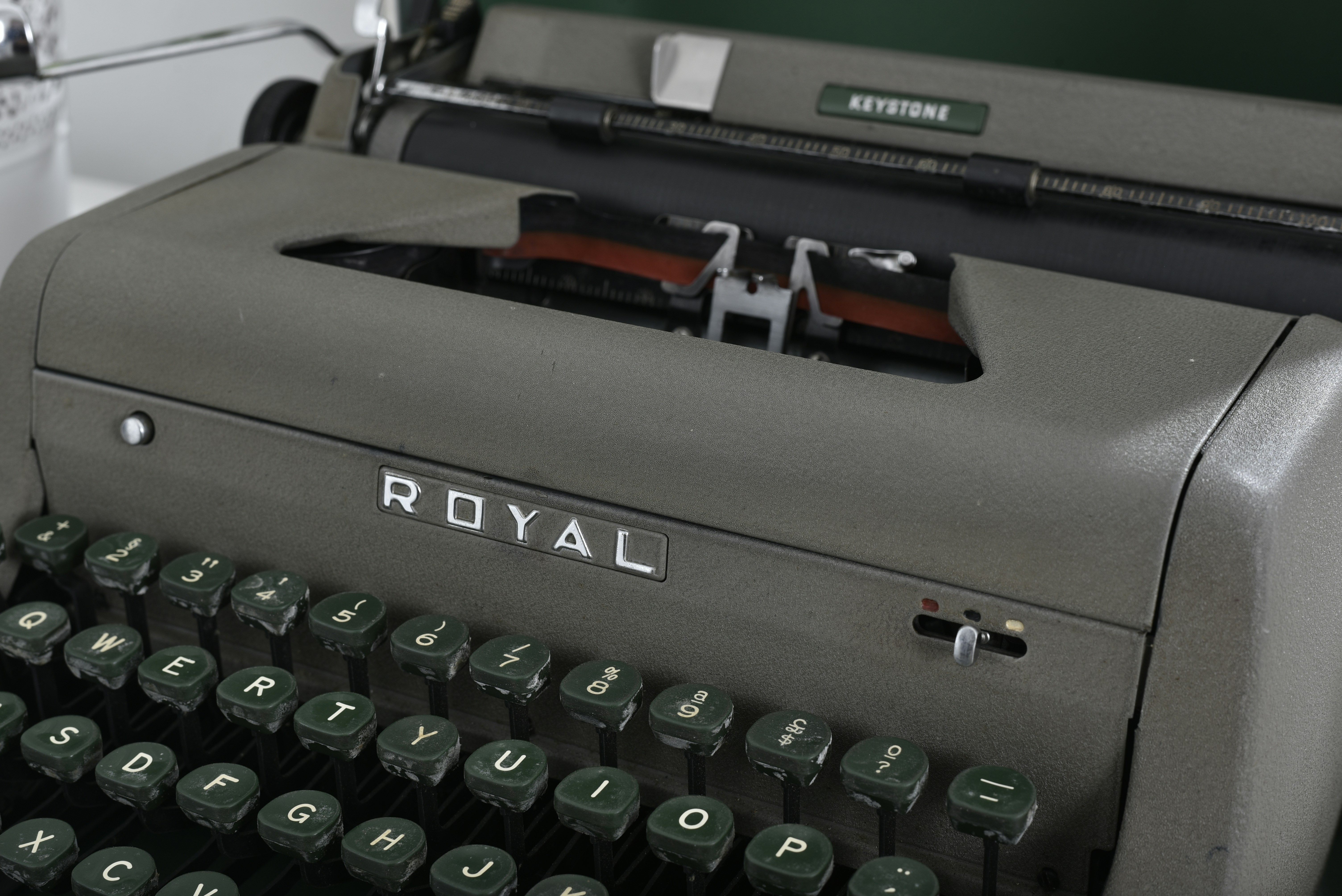 an old royal typewriter sitting on a desk