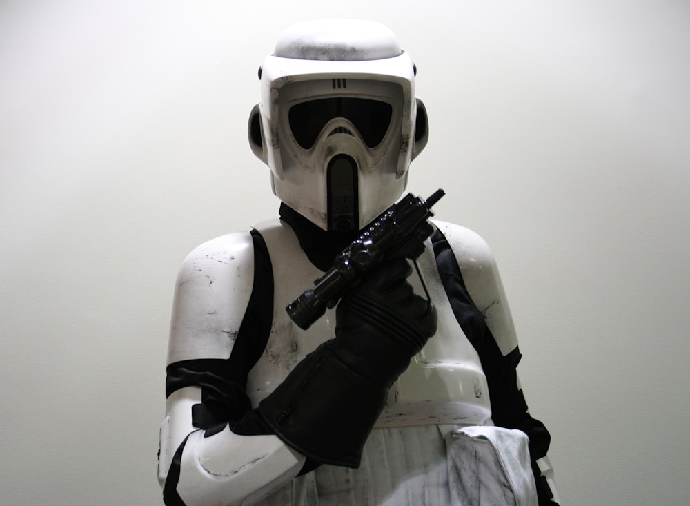 a storm trooper with a gun in his hand