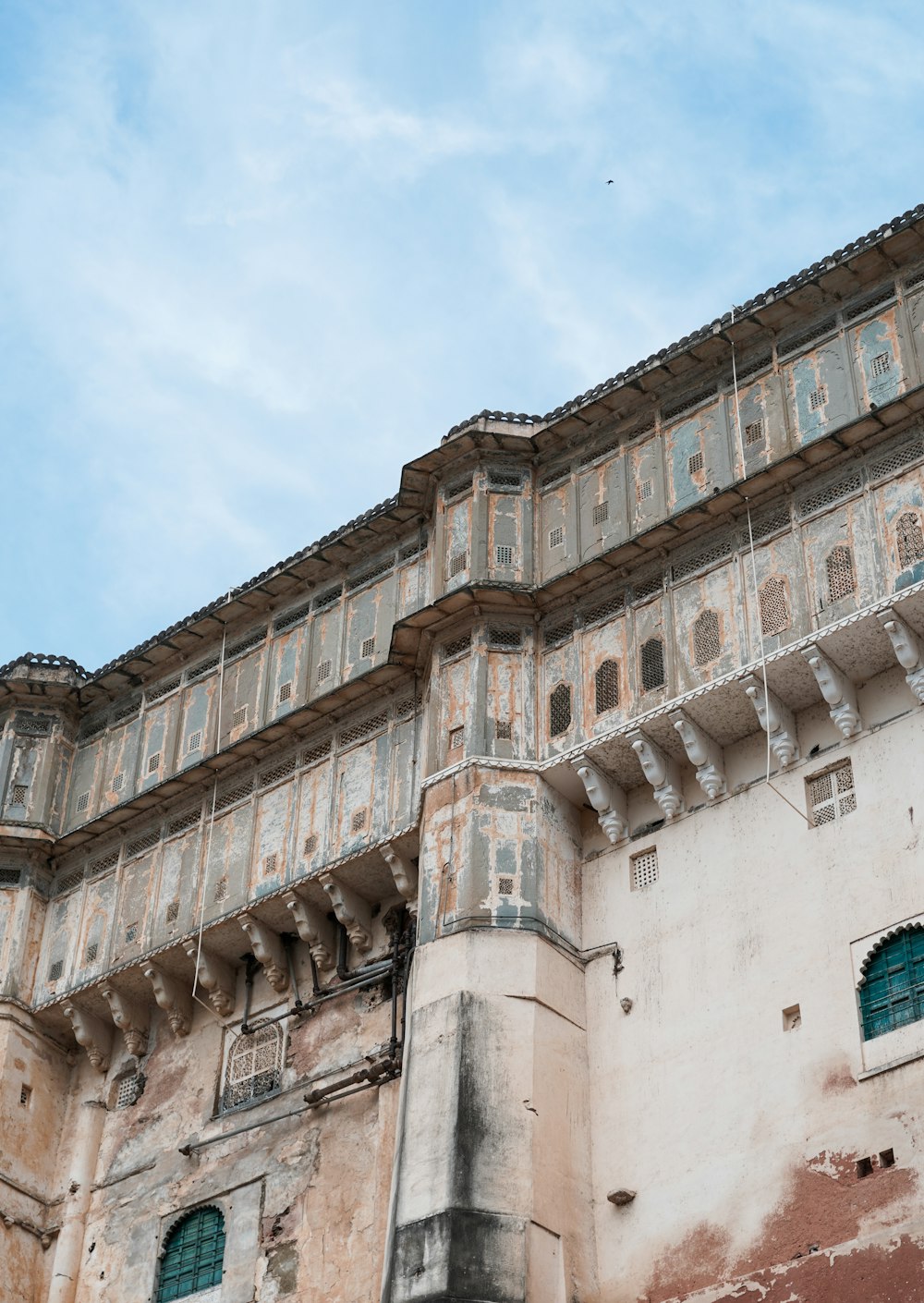 an old building with a clock on the front of it