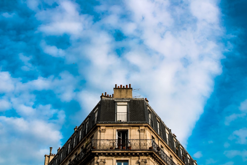 a tall building with a sky background