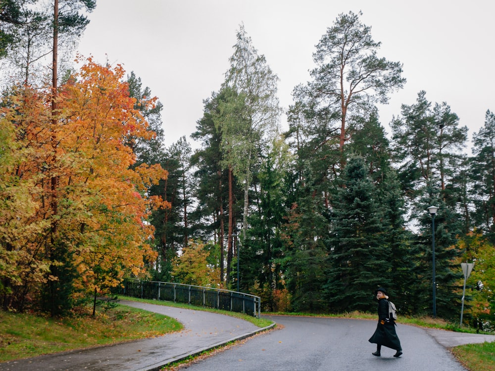 a person riding a skateboard down a road