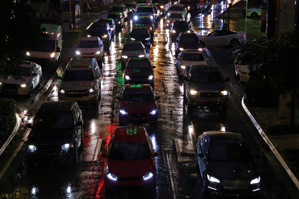 a city street filled with lots of traffic at night