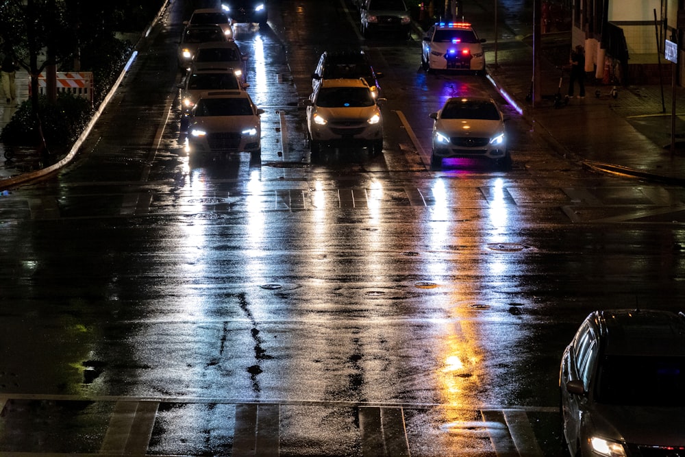 a city street filled with lots of traffic at night