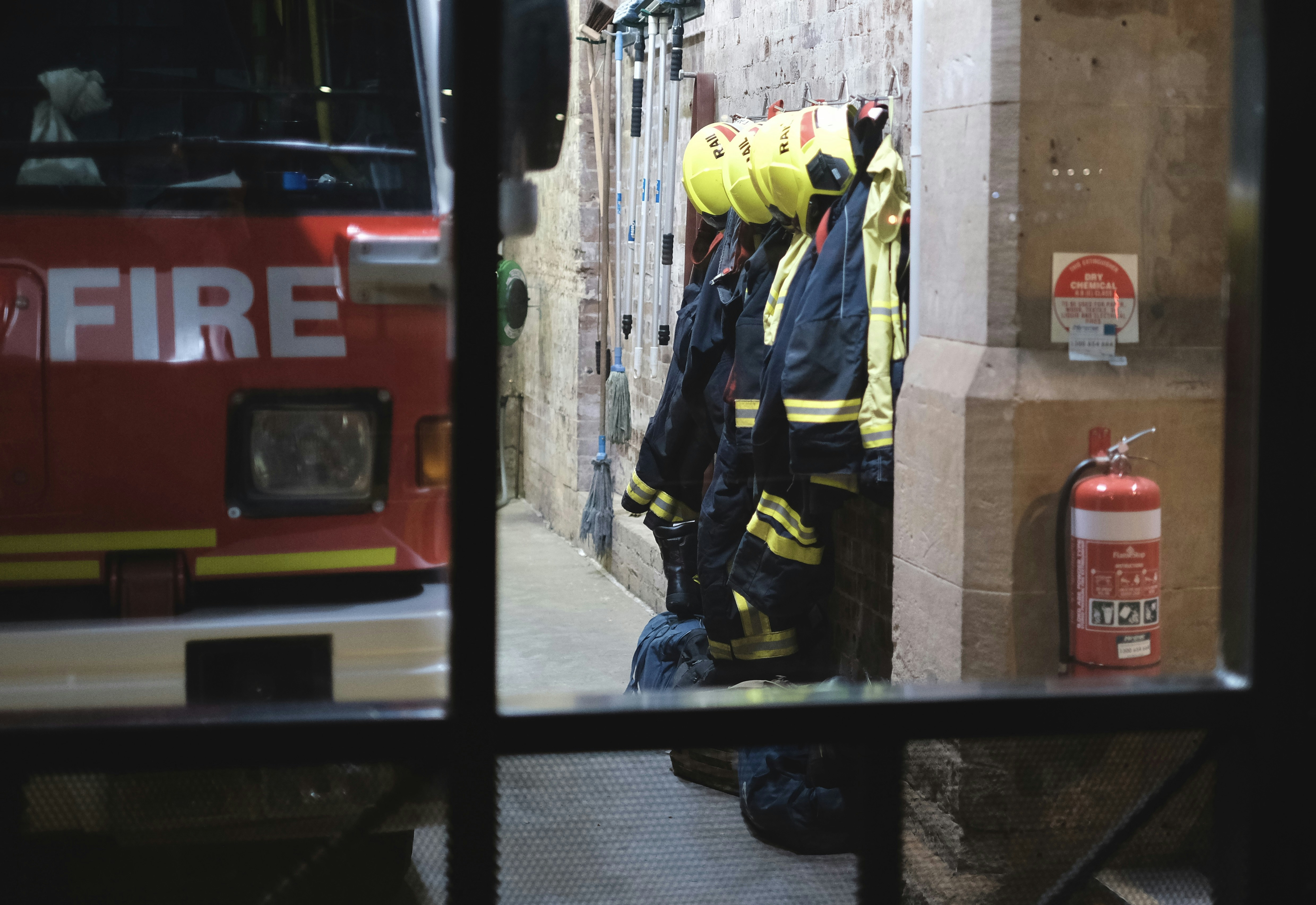 A firefighter's gear is on display in a window photo – Free Person ...