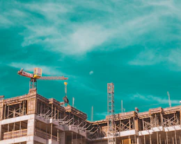 a crane on top of a building under construction
