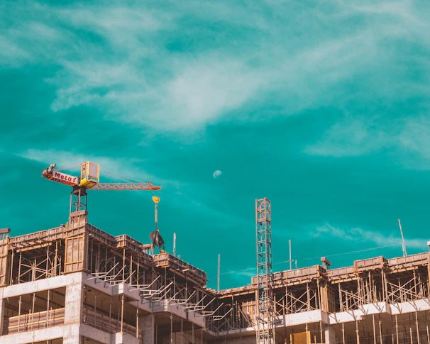 a crane on top of a building under construction