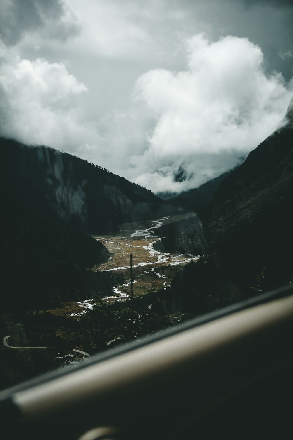 a view of a valley from a plane window