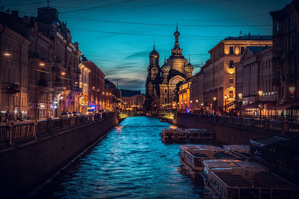 a river running through a city next to tall buildings