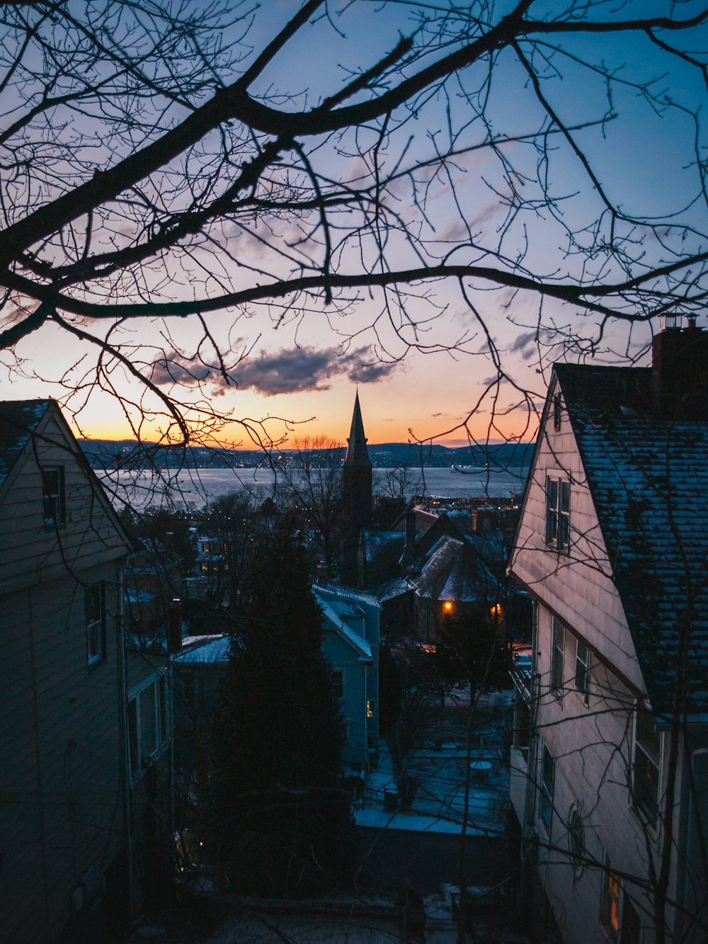 a view of a city at dusk from a rooftop