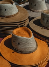 a pile of hats sitting on top of each other