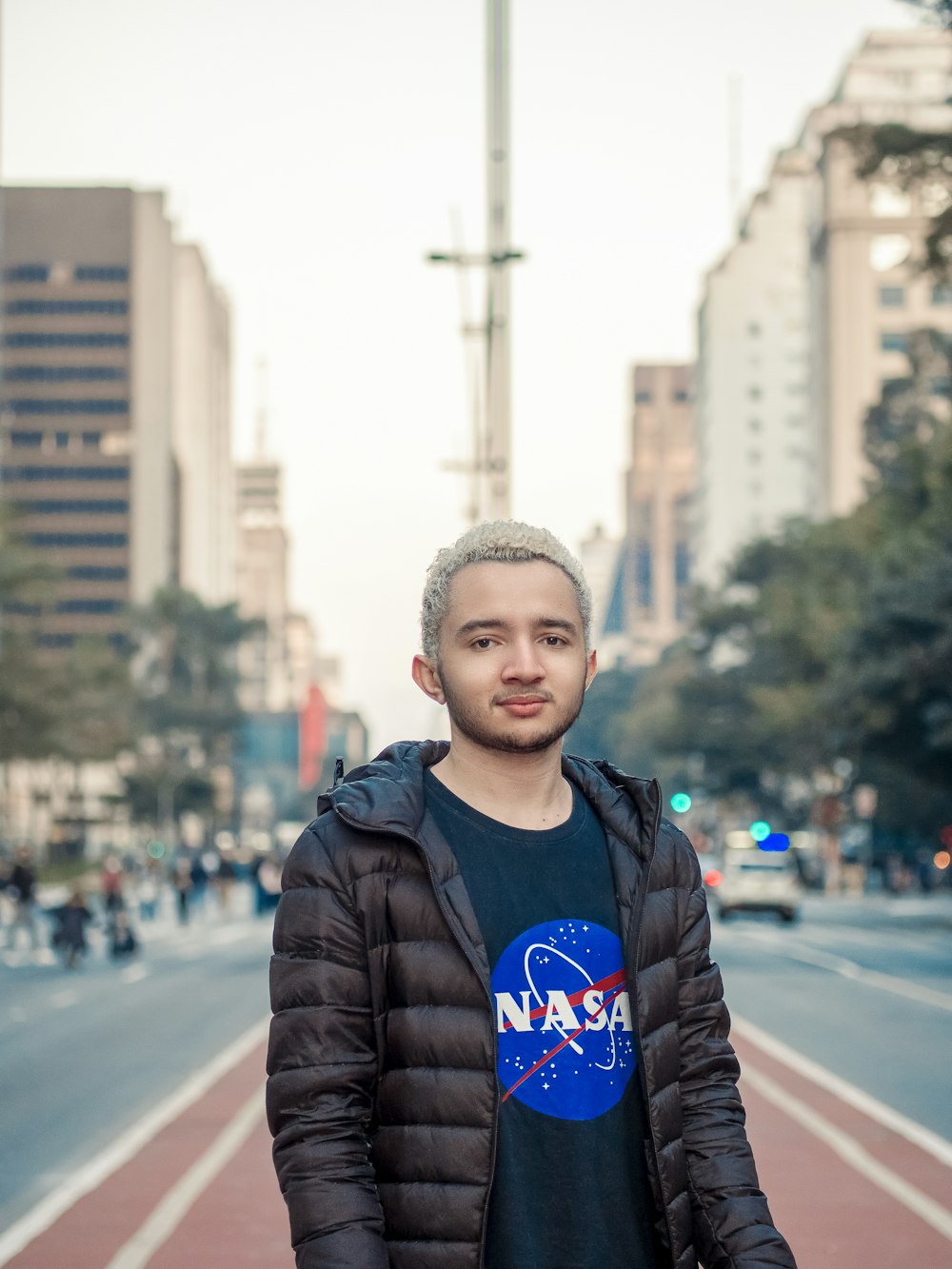 a man standing on the side of a road