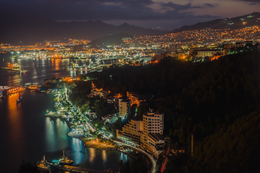 a view of a city at night from a hill