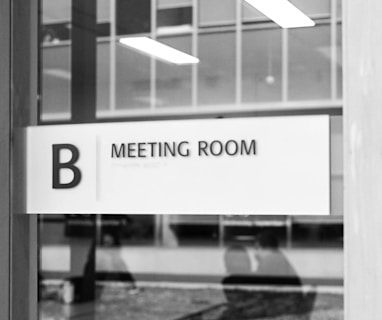 a black and white photo of a meeting room