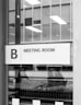 a black and white photo of a meeting room