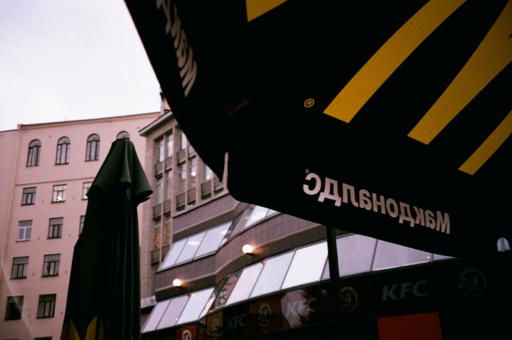 a large mcdonald's sign hanging from the side of a building