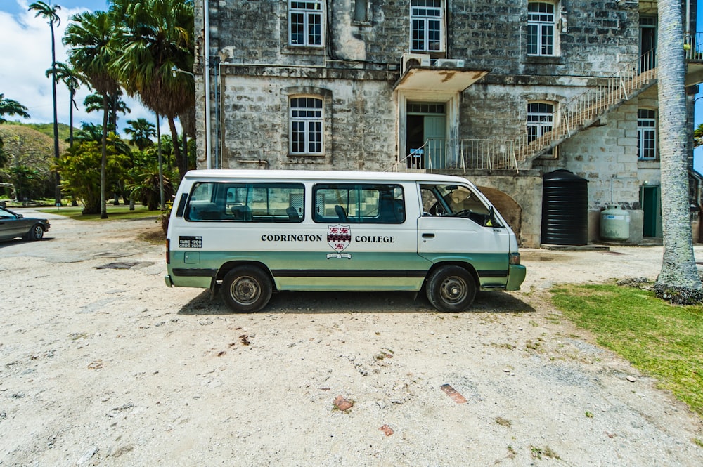a van parked in front of an old building
