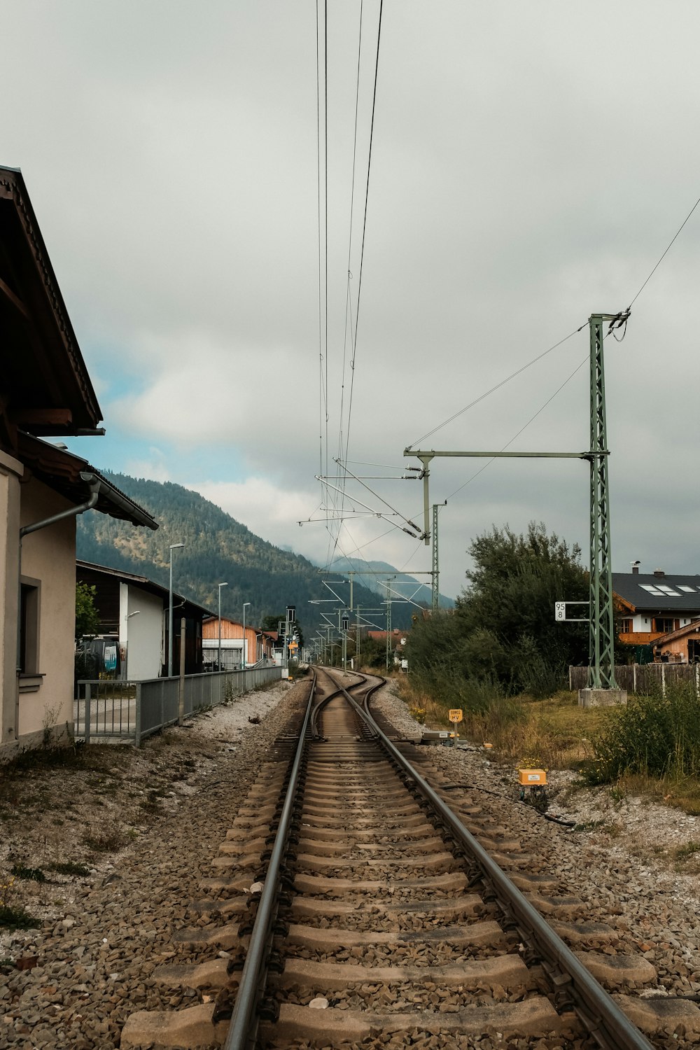 a train track running through a rural area