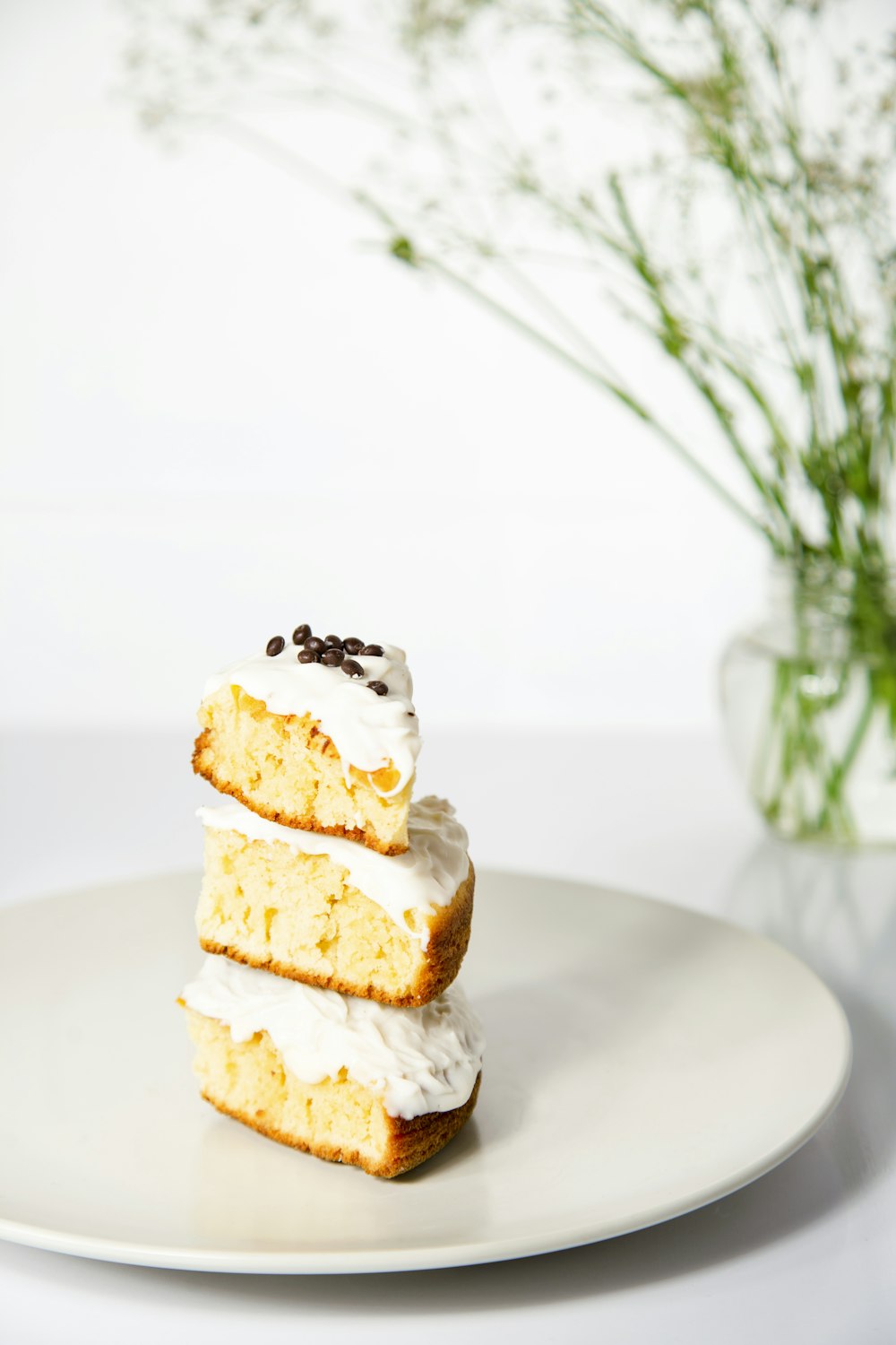 three pieces of cake sitting on top of a white plate