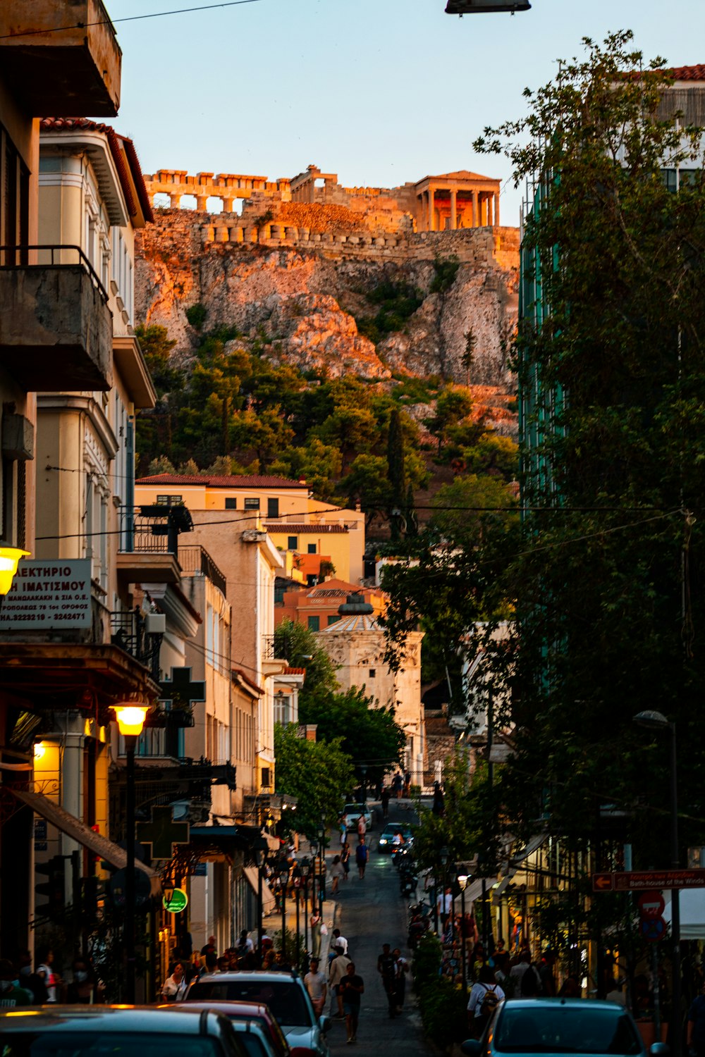 a city street with cars parked on the side of it