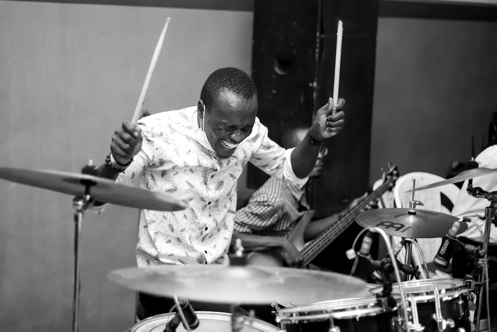 a man playing drums in a recording studio