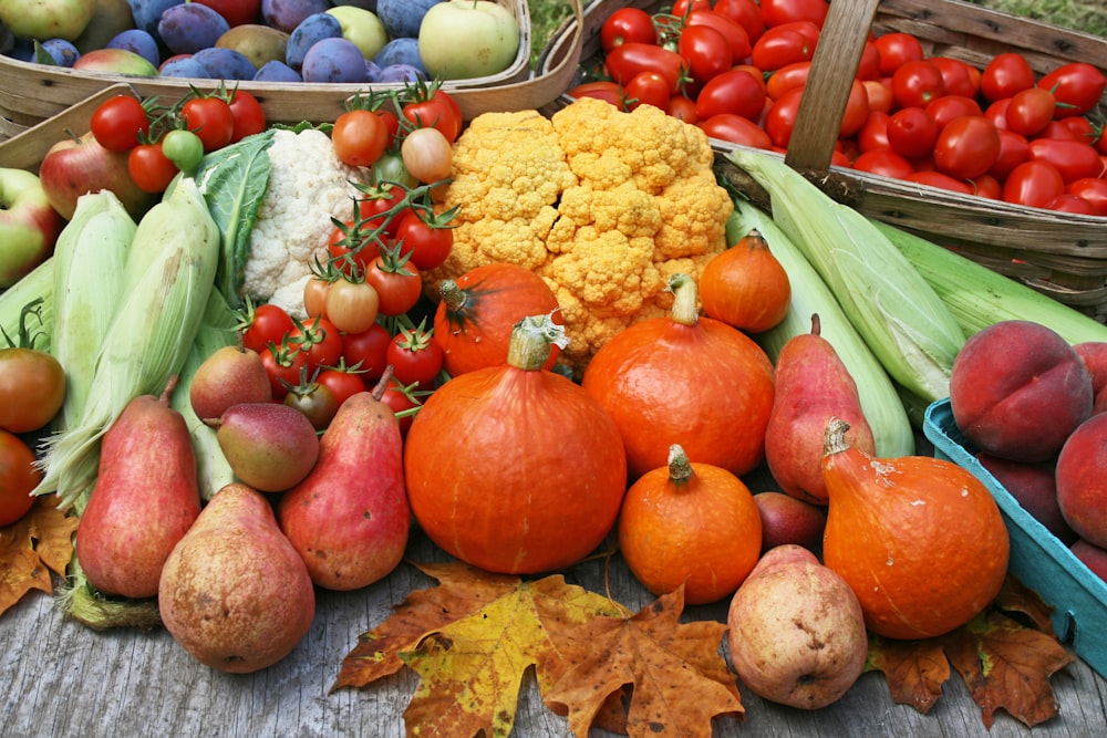 a table topped with lots of different types of fruits and vegetables