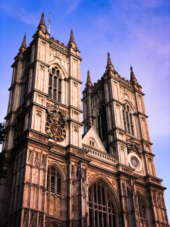 a large cathedral with a clock on the front of it