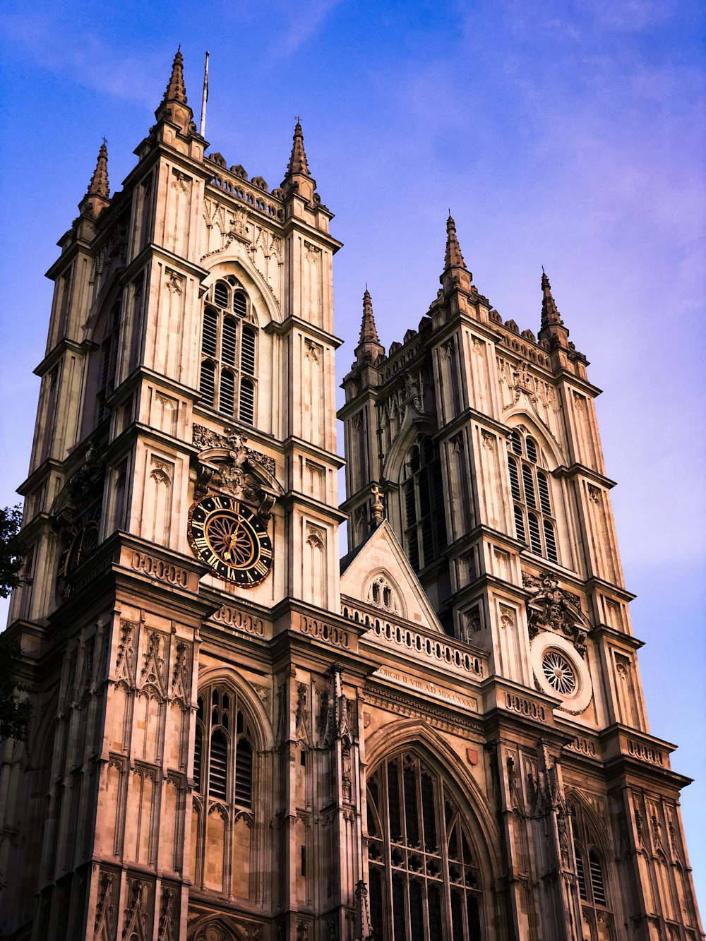 a large cathedral with a clock on the front of it