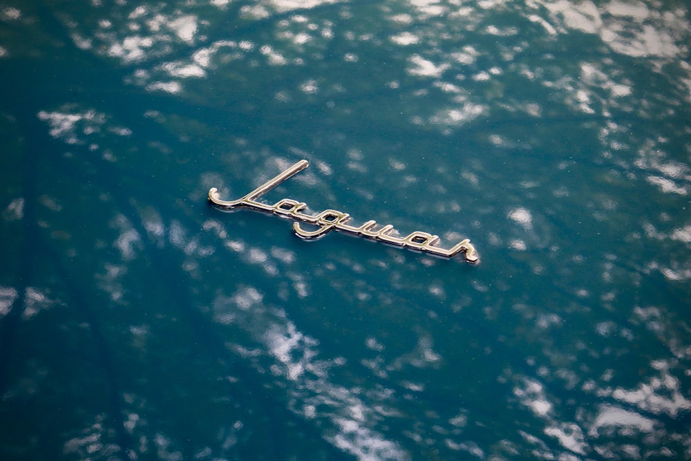 a close up of the name of a boat in the water