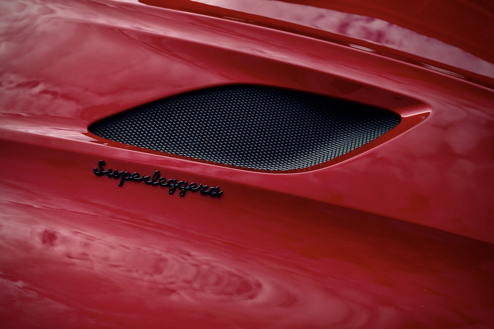 a close up of a red sports car