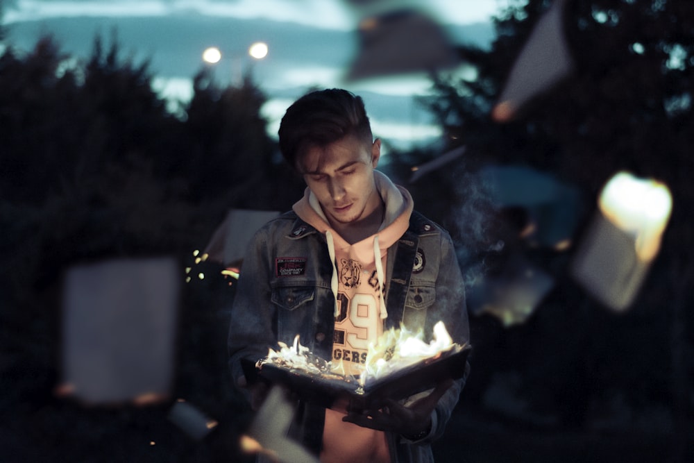 a man holding a tray with a cake on it