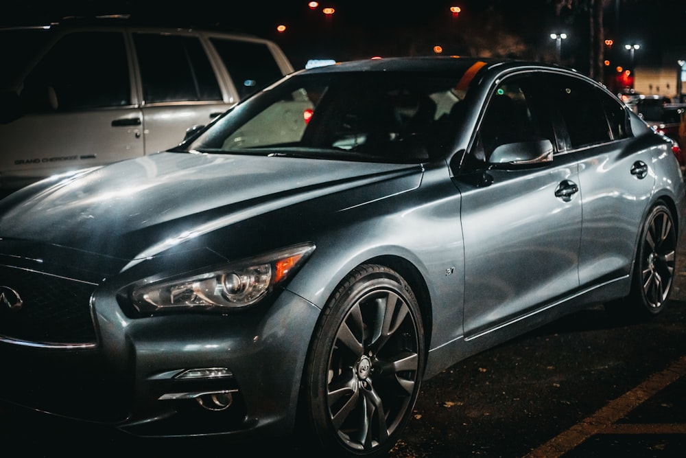 a silver car parked on the side of the road