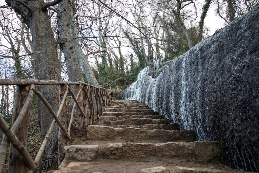 a set of steps leading up to a waterfall