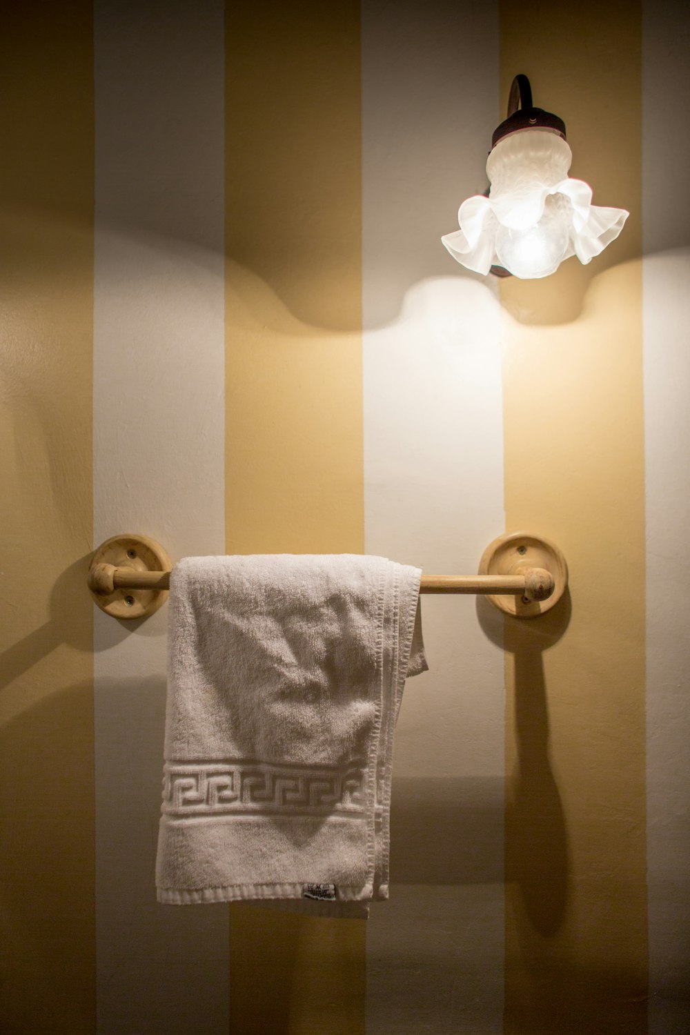 a towel hanging on a towel rack in a bathroom