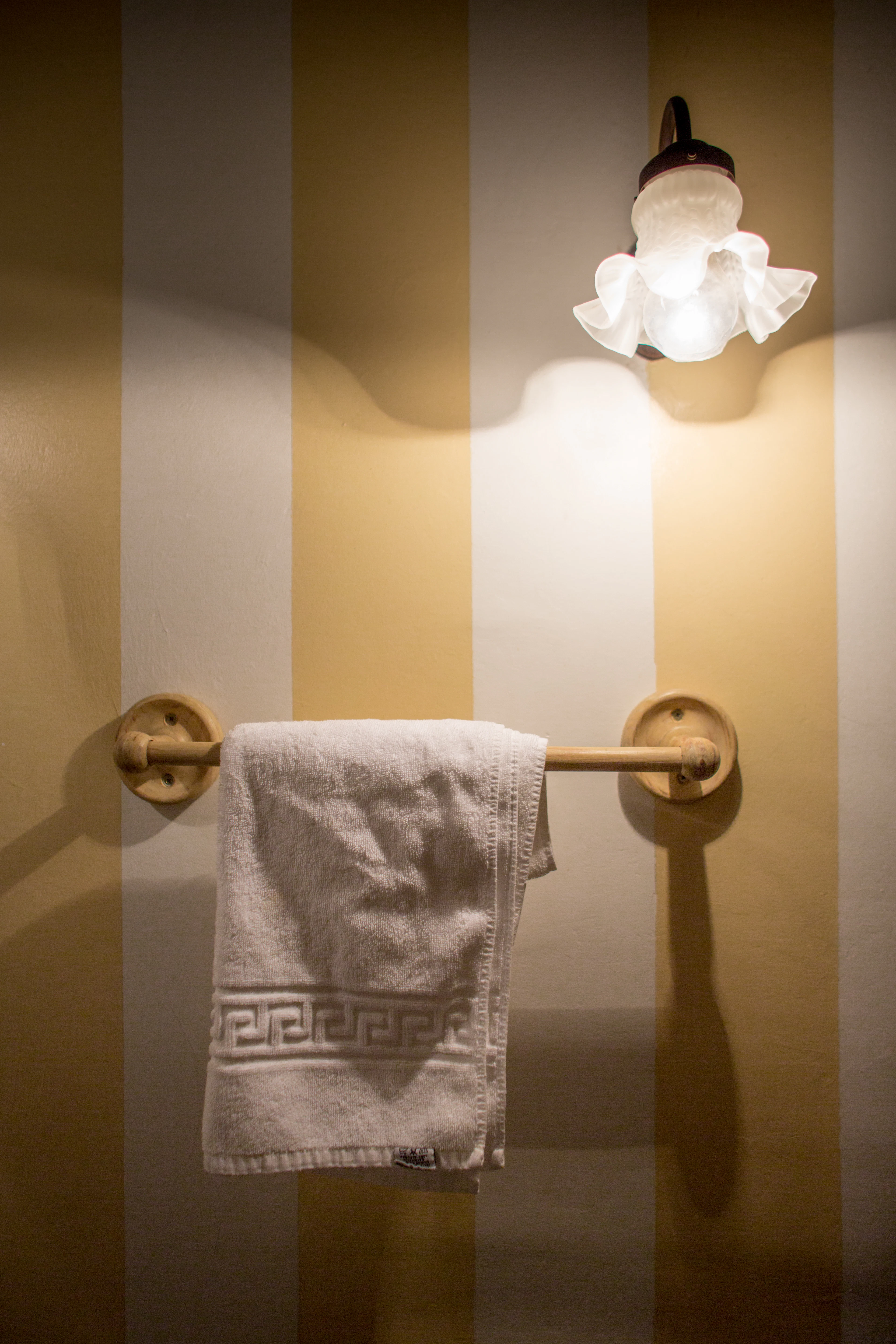 Brass towel bar with a linen towel