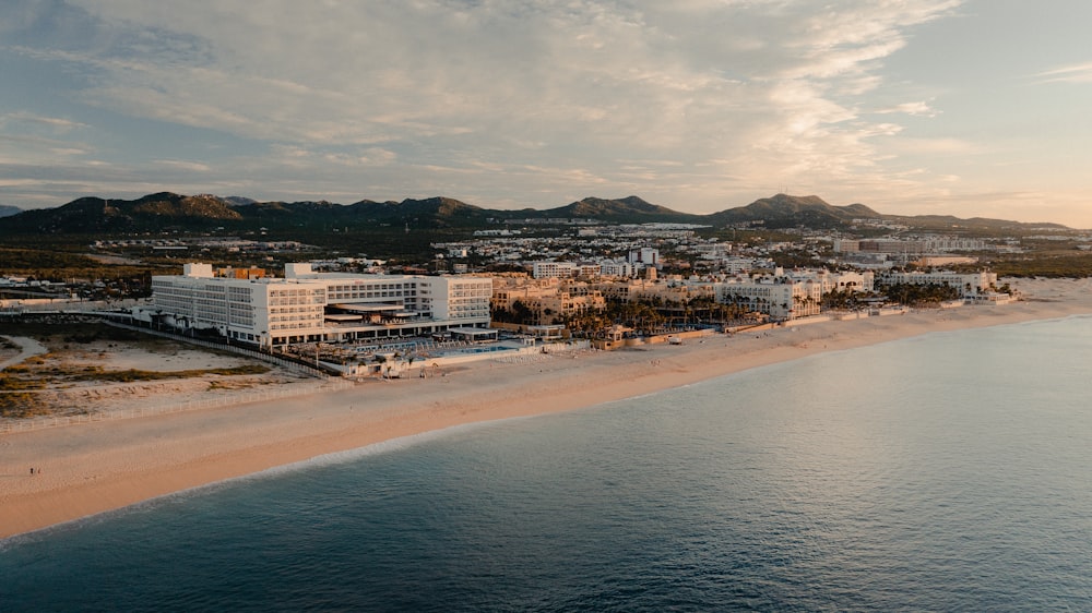 an aerial view of a resort on the beach