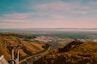 a view of a city from a mountain top