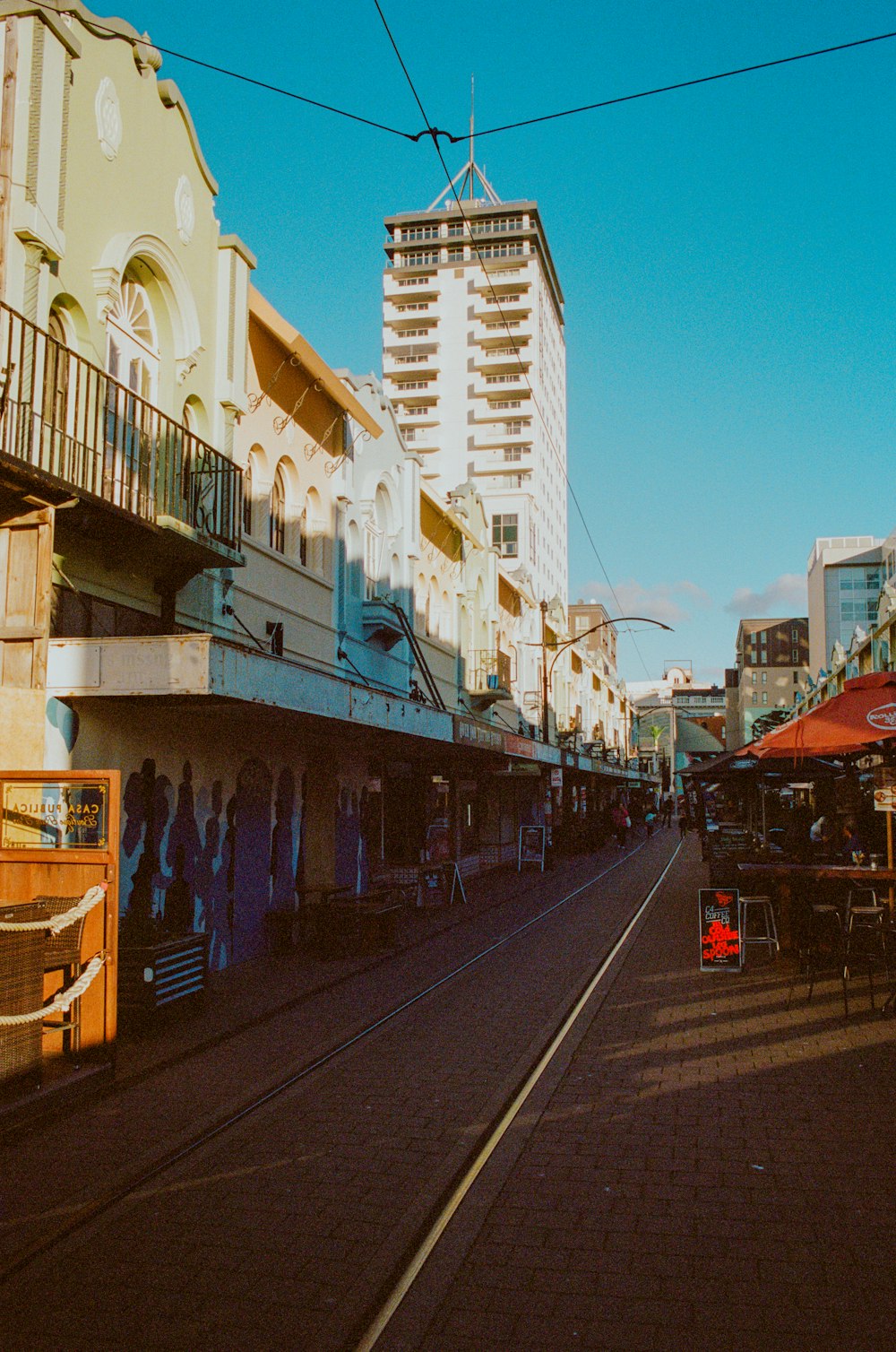 a train track running through a city with tall buildings