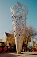 a large metal sculpture sitting in the middle of a park